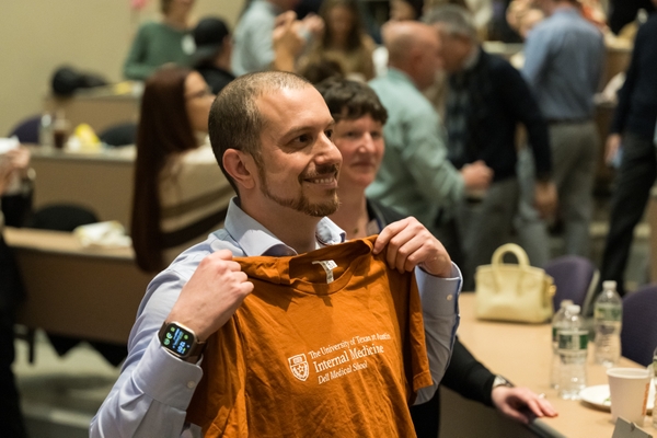 Ian DeAndrea-Lazarus, PhD, (UT- Austin, Dallas SOMD) sports a t-shirt. // University of Rochester School of Medicine and Dentistry students find out where their residencies will be on Match Day at the URMC March 15, 2024. // photo by J. Adam Fenster / University of Rochester