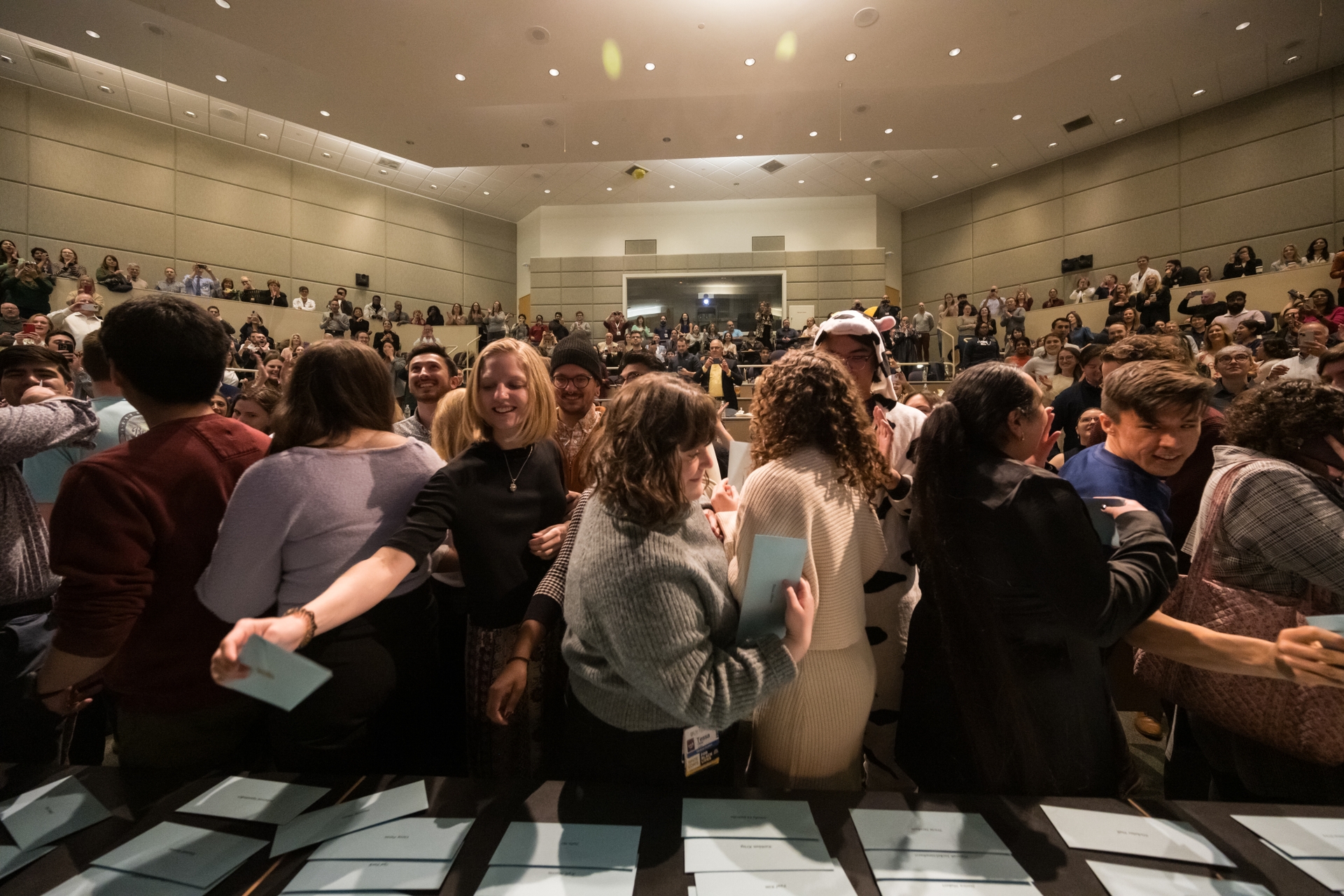 Medical students pick up envelopes with their matches inside. // University of Rochester School of Medicine and Dentistry students find out where their residencies will be on Match Day at the URMC March 15, 2024. // photo by J. Adam Fenster / University of Rochester