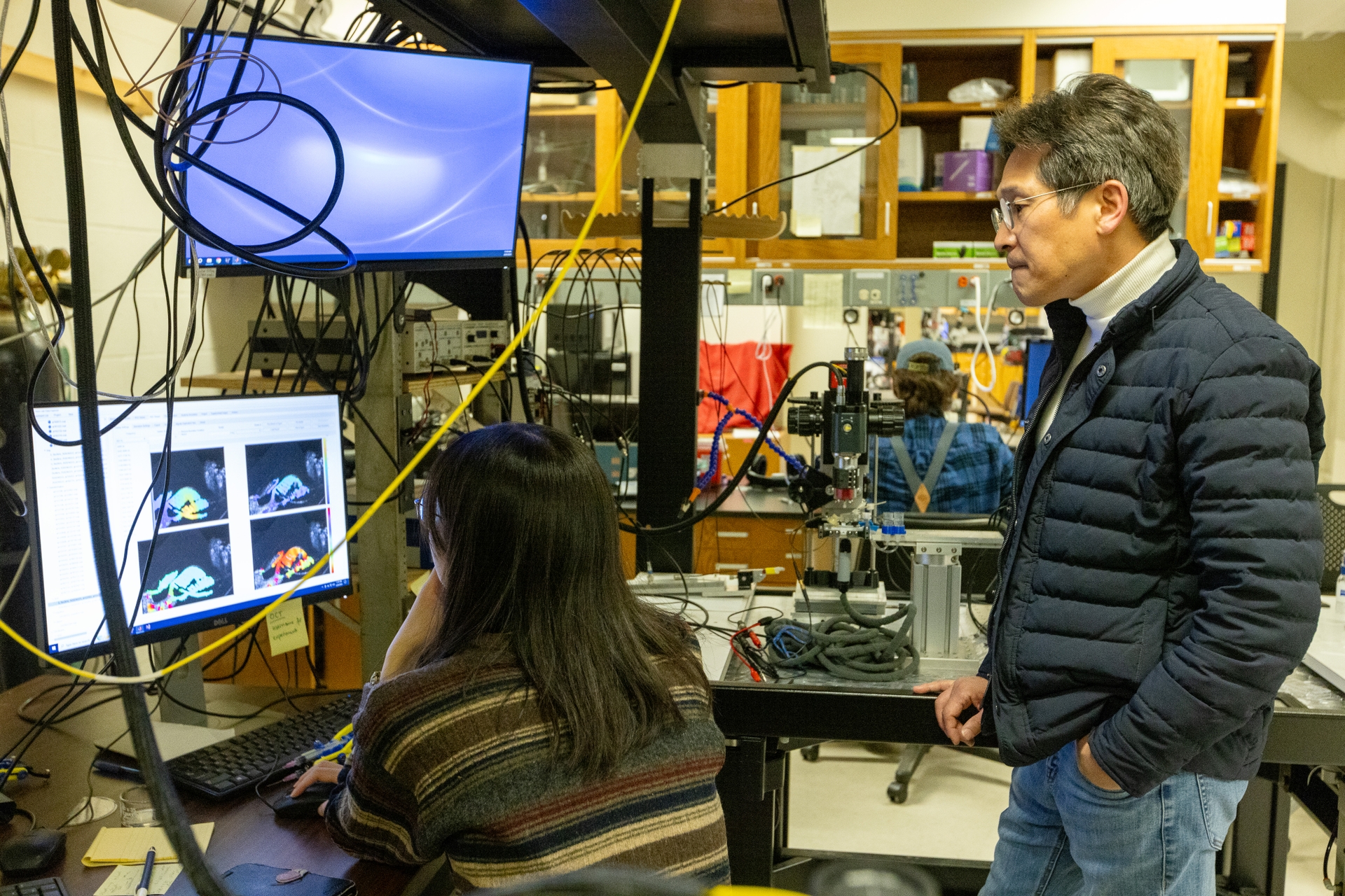 Jong-Hoon Nam, PhD, (right) and Mechanical Engineering graduate student Wei-Ching Lin (left) discuss acquired data of colloquial vibrations in the Nam Lab at the University of Rochester.