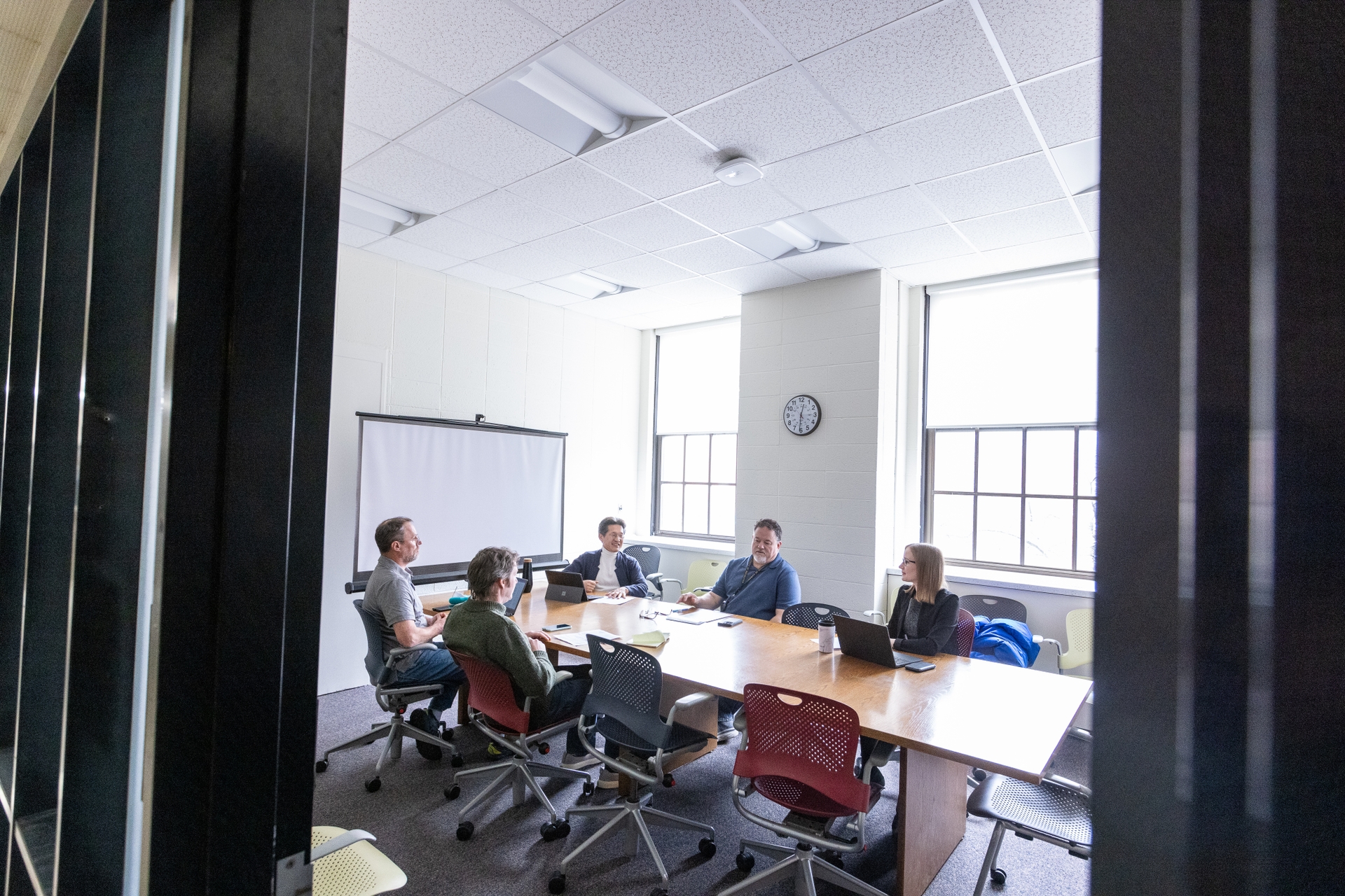 Grant writing group meets weekly on the University of Rochester campus. From front left: Eric Anson, PhD, Kenneth Henry, PhD. From back left: Jong-Hoon Nam, PhD, J. Chris Holt, PhD, Sarah Hayes, AuD, PhD.