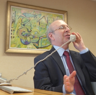 Image of Mark Taubman, MD on telephone