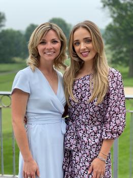 Two women wearing dresses
