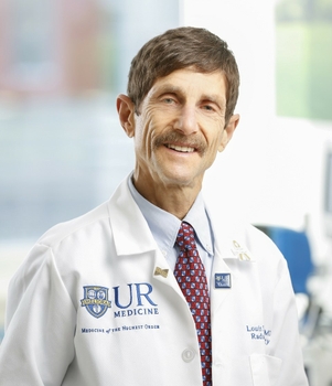 headshot of L Sandy Constine MD in a white coat