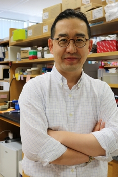 Professional portrait of Minsoo Kim, PhD, in his lab at URMC