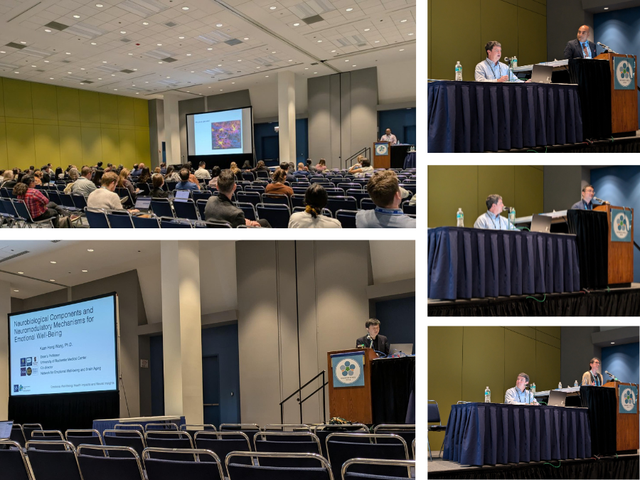 empirical neuroscience research researchers on stage and at podiums presenting work.