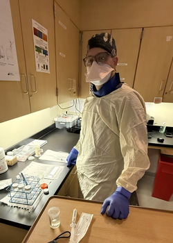 Jeff Civiletti in full personal protective equipment in laboratory setting