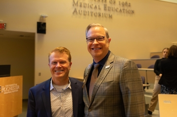 Tait Shanafelt, MD, and Craig Rooney, PhD, stand next to each other