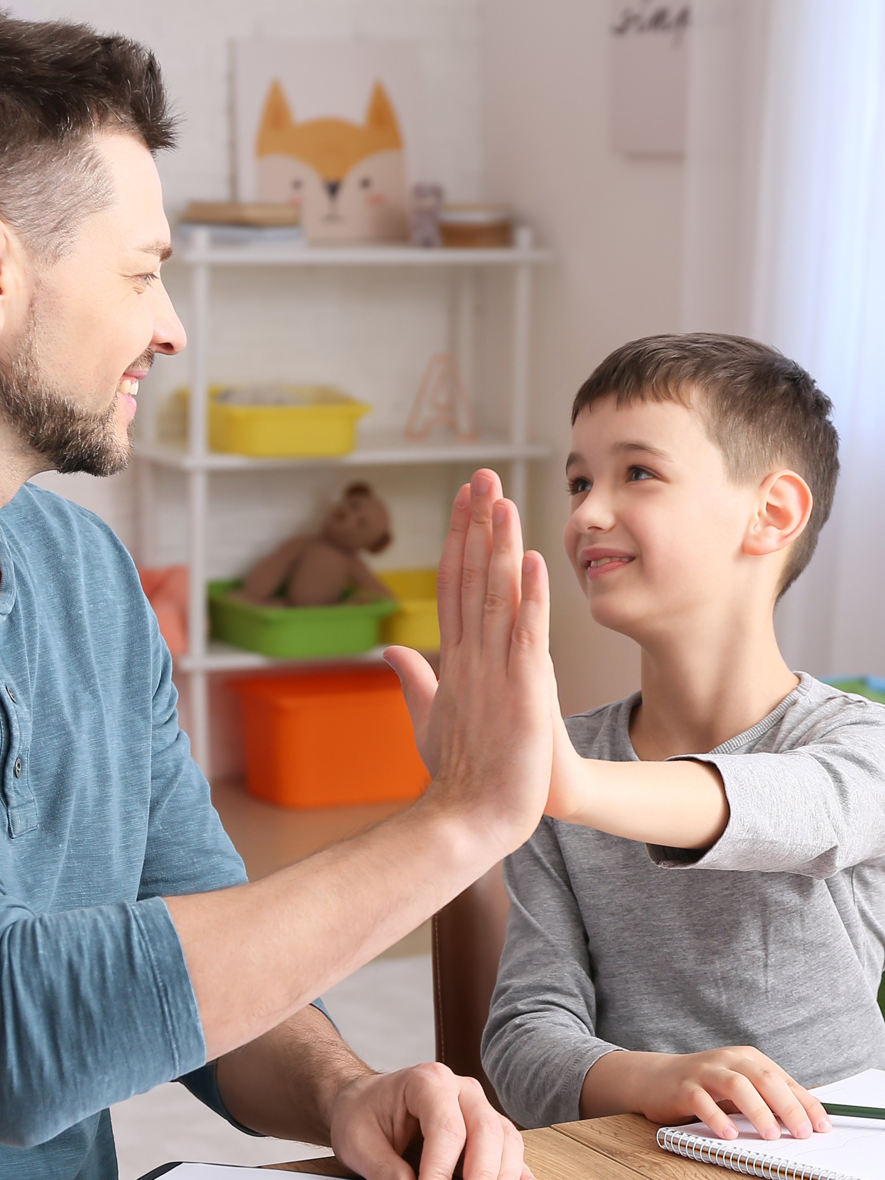 Child and adult high five