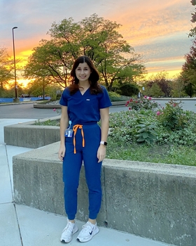 a portrait of Dr. Shine in front of a sunset