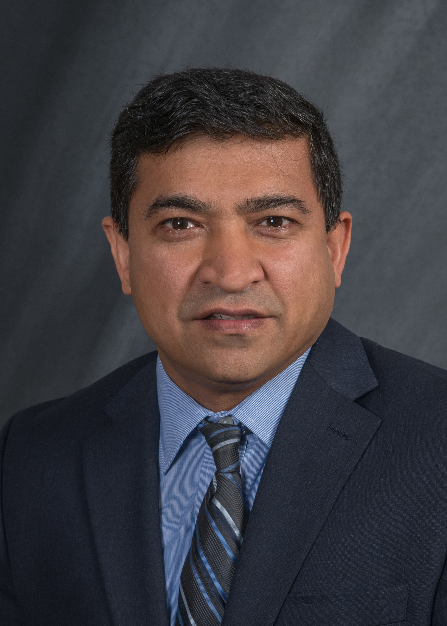 a portrait of Dr. Basir Barmak