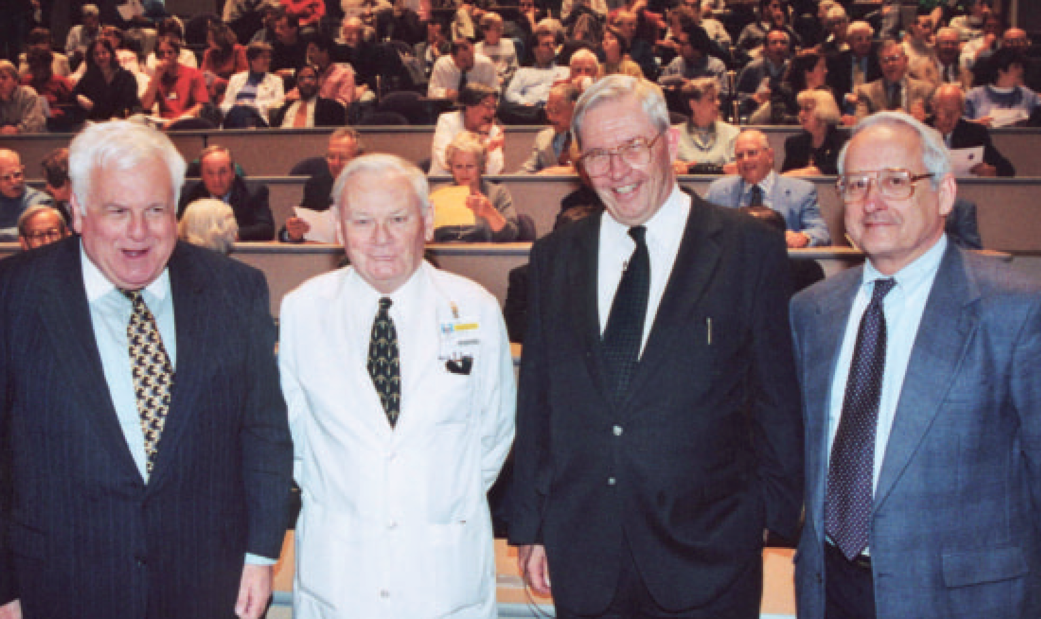 From left: Lowell A. Goldsmith, M.D., Robert Joynt, M.D., Ph.D., D. A. Henderson, and Jules Cohen, M.D., at Henderson’s 1999 URMC bioterrorism talk.