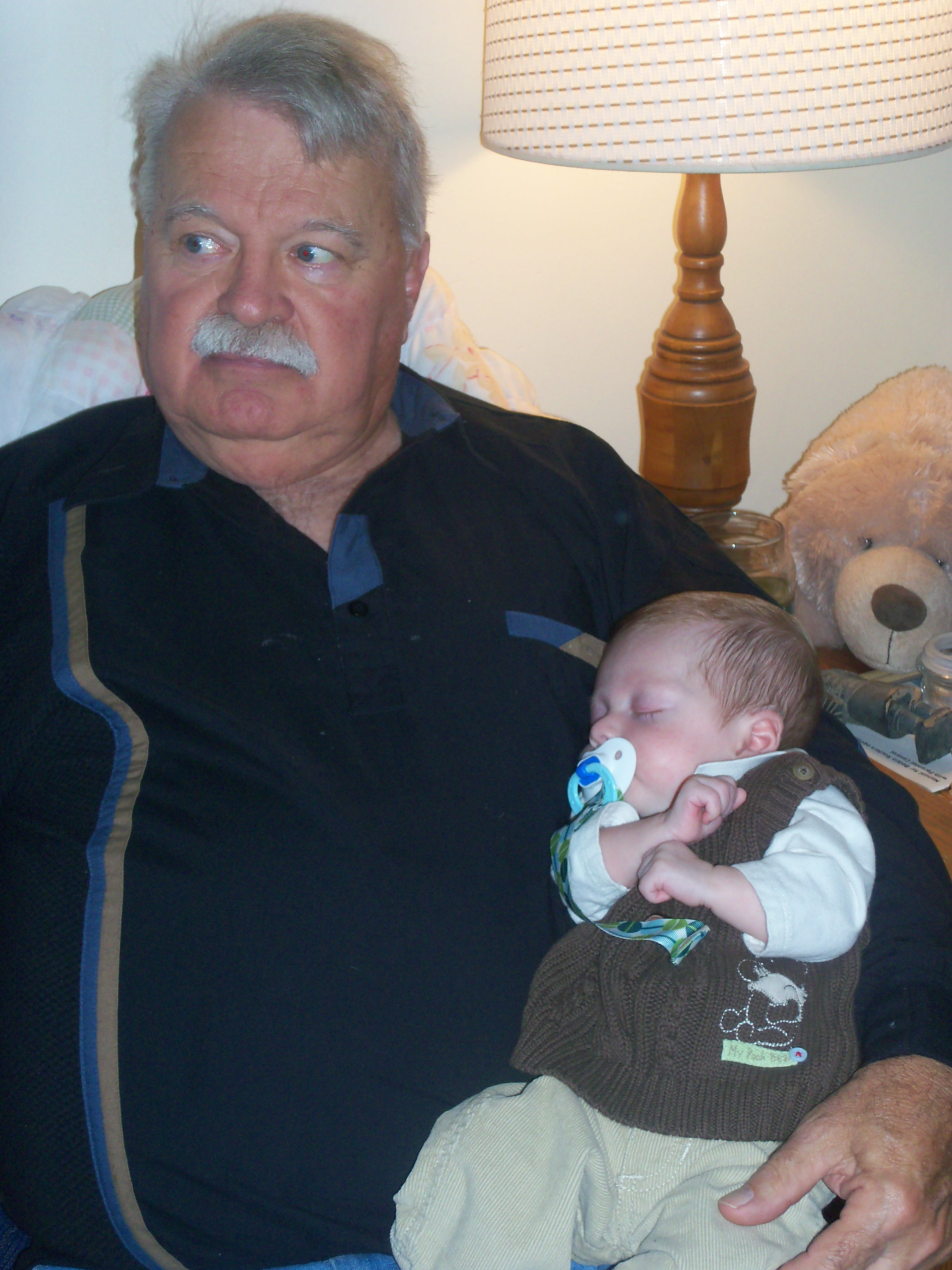 David Beatson holds his grandson