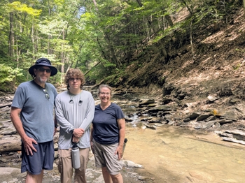 Three members of the Calvert family hanging out at a state park