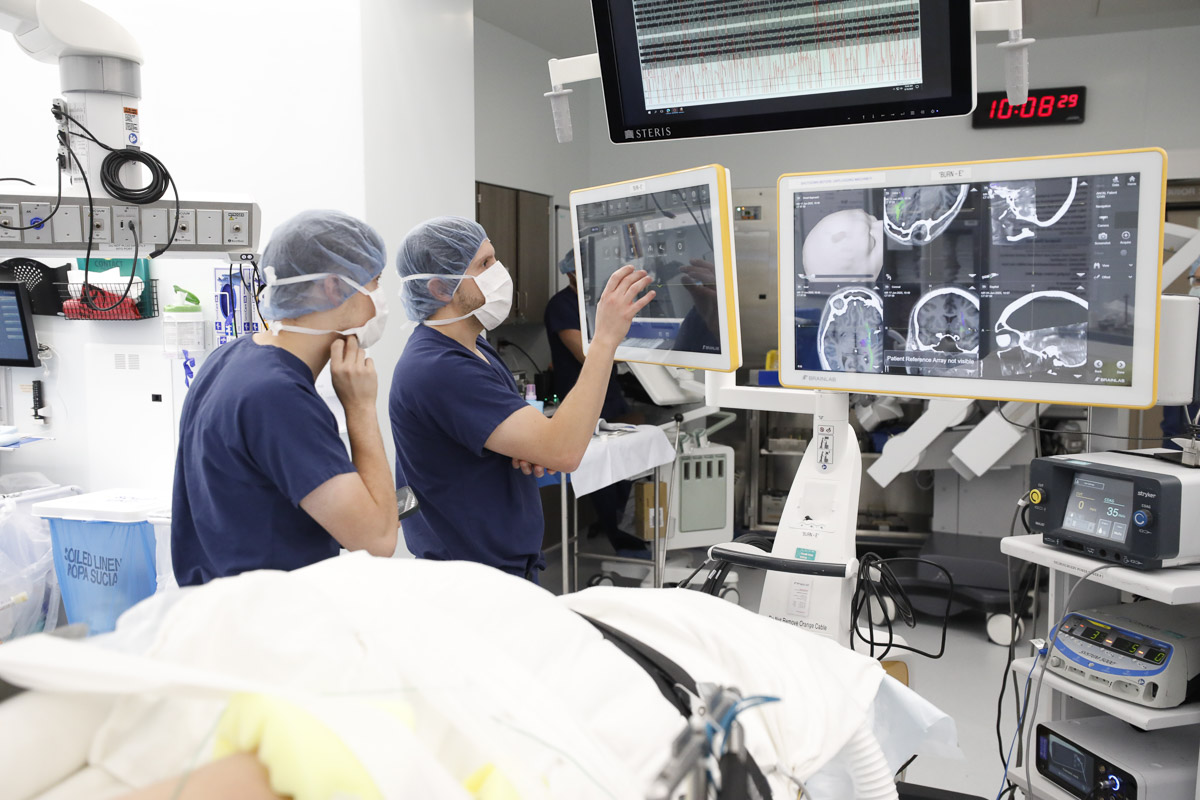 Members of the brain mapping team, including Frank Garcea, PhD, (right), prepare for an awake craniotomy surgery at the University of Rochester's Strong Memorial Hospital.