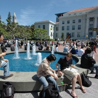 A photo of students sitting around a fountain on the UC Berkeley campus