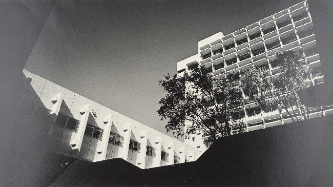 An archival, black and white photo showing the south facade of UC Berkeley's Bauer Wurster Hall, taken in 1964