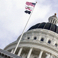 The dome of the California state capitol in Sacramento, with flags