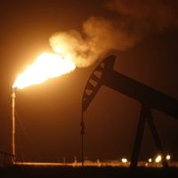 night turned red by flaring gas from oil well