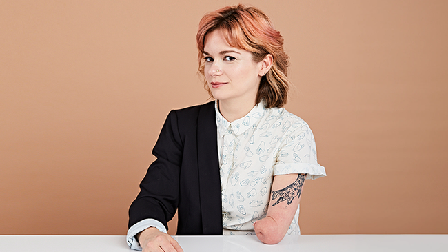 a person looks at the camera through the sides of her eyes