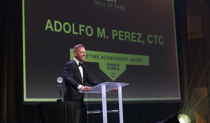 Adolfo Perez accepts CLIA Hall of Fame Lifetime Achievement Award (Image at LateCruiseNews.com - March 2025)