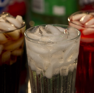 Soft Drinks in Glass with Bottles