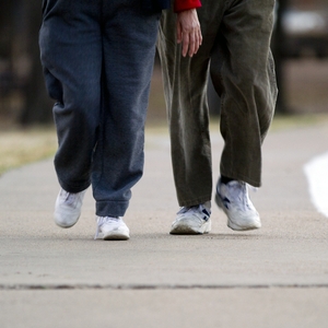 Walking - man and women toward - Outside track