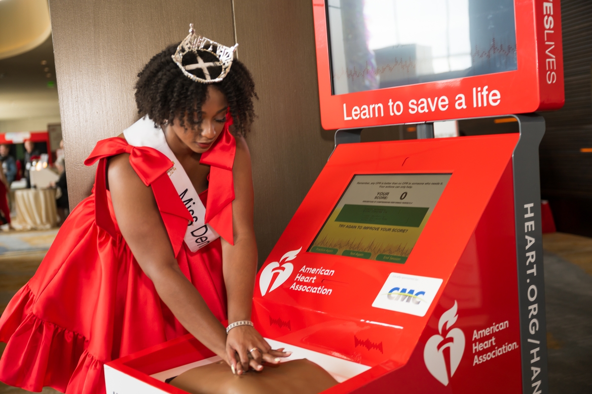 Photo Miss Denton practices Hand Only CPR American Heart Association