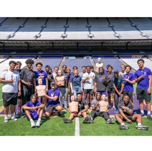 NOL - Kaila and Greg pose with team members