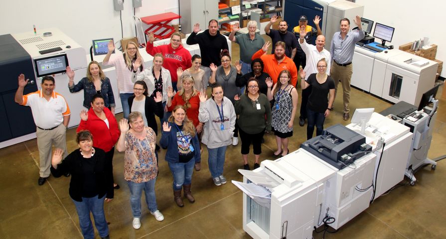 The i3logix team and Xerox presses