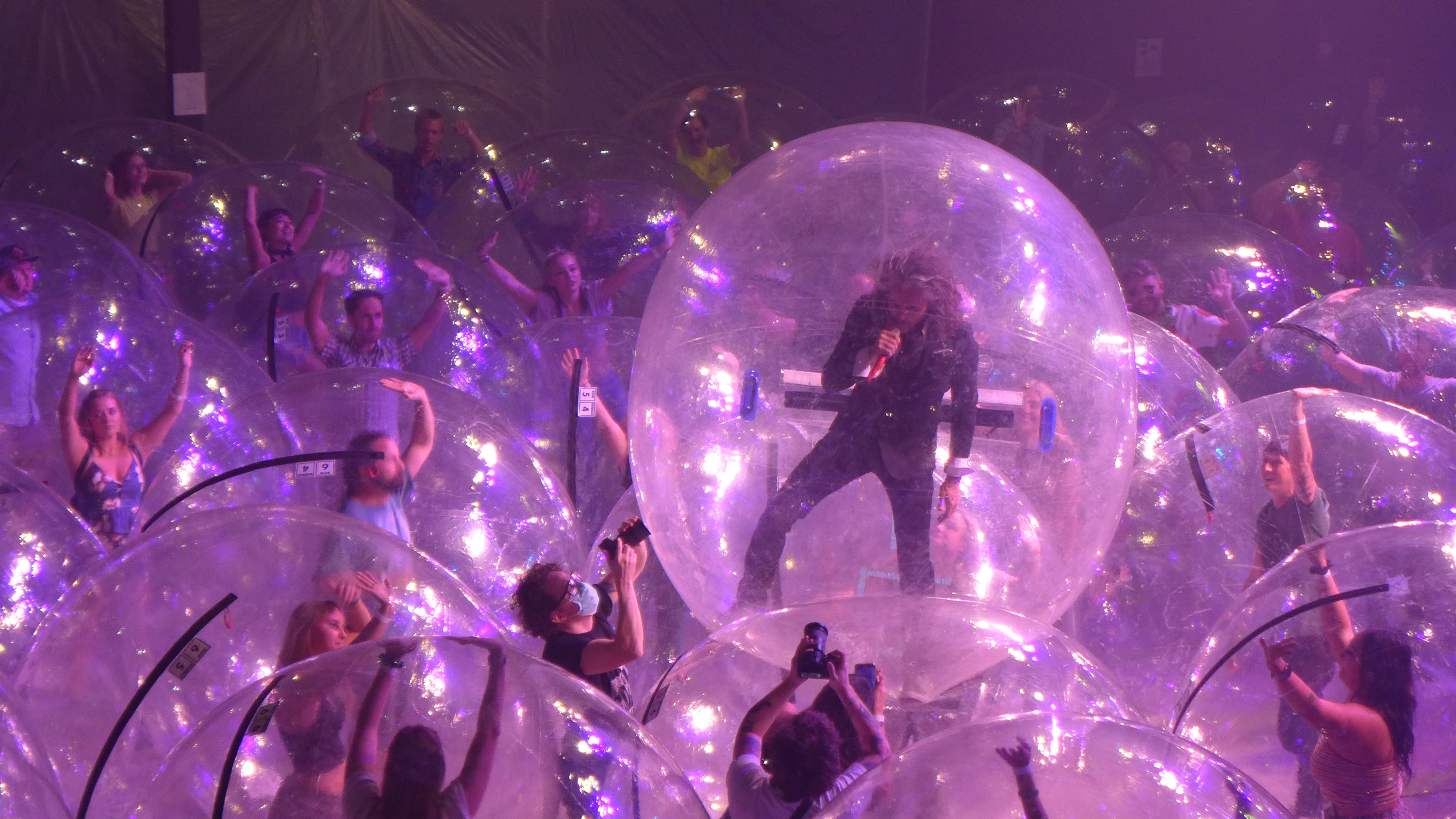 The Flaming Lips performed a concert with the band and fans encased in plastic bubbles