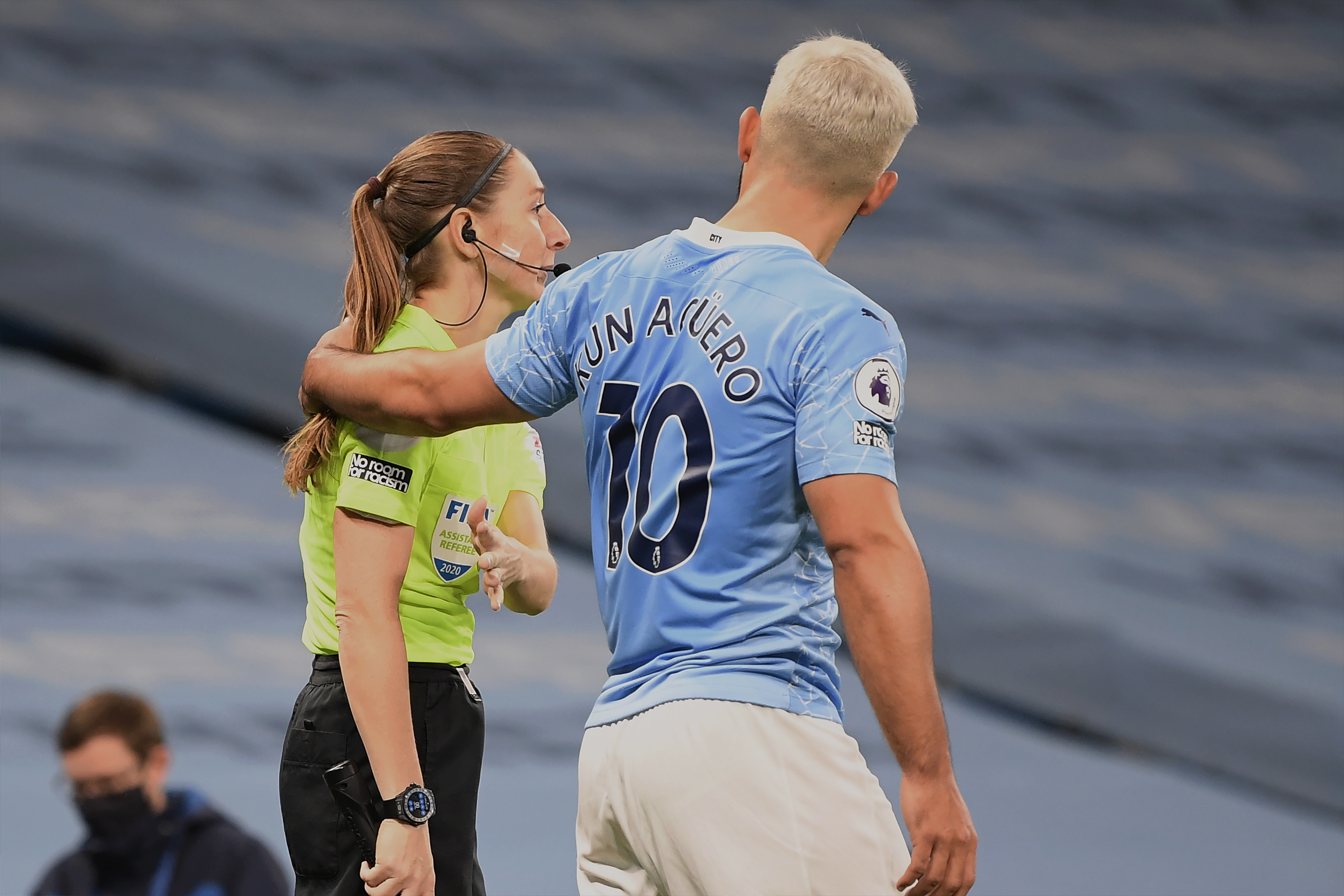 Manchester City star Sergio Aguero widely criticized for putting his hand on the shoulder of a female official