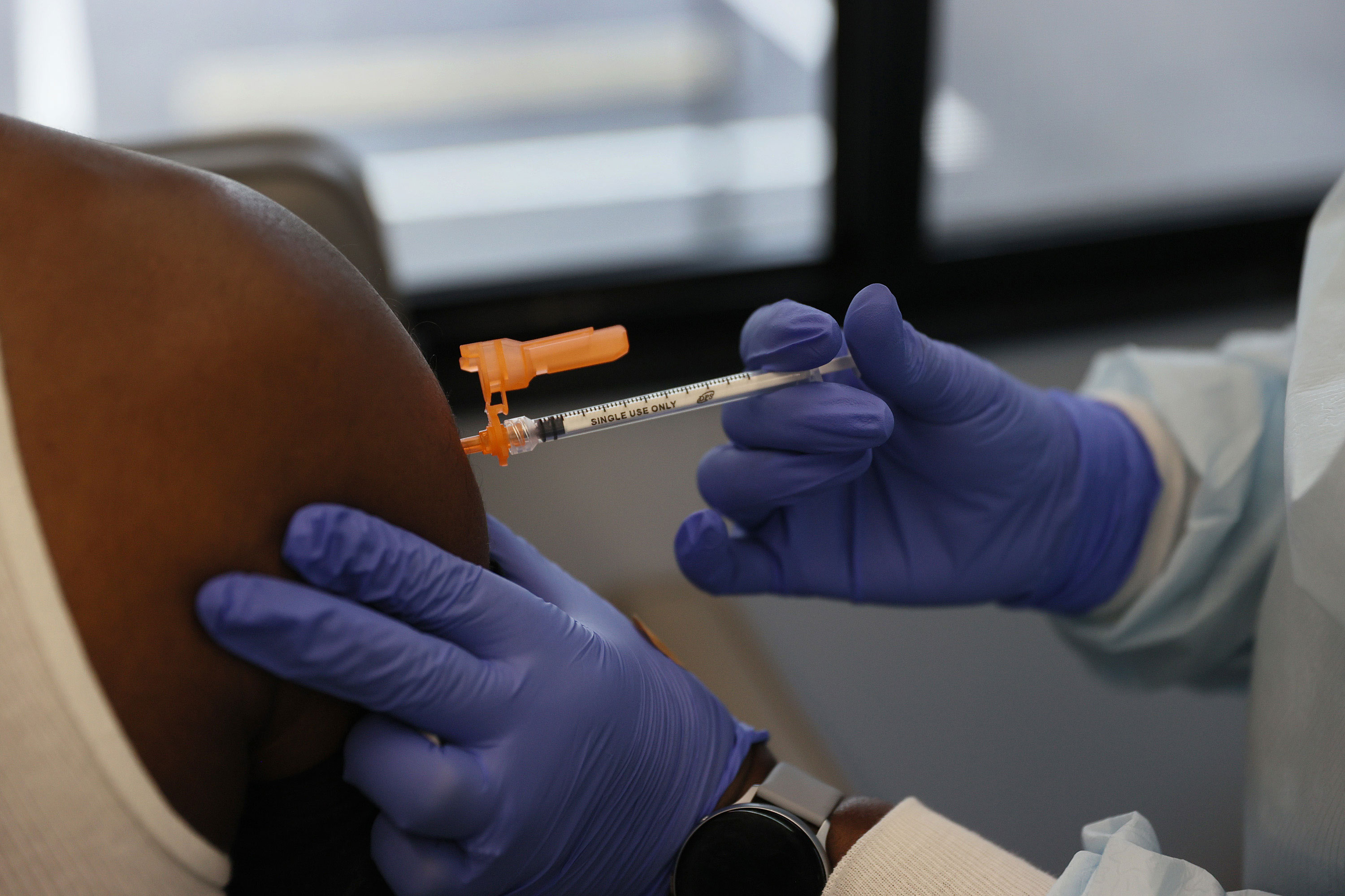 Pediatricians work to close gaps in Covid-19 vaccine coverage by vaccinating adults