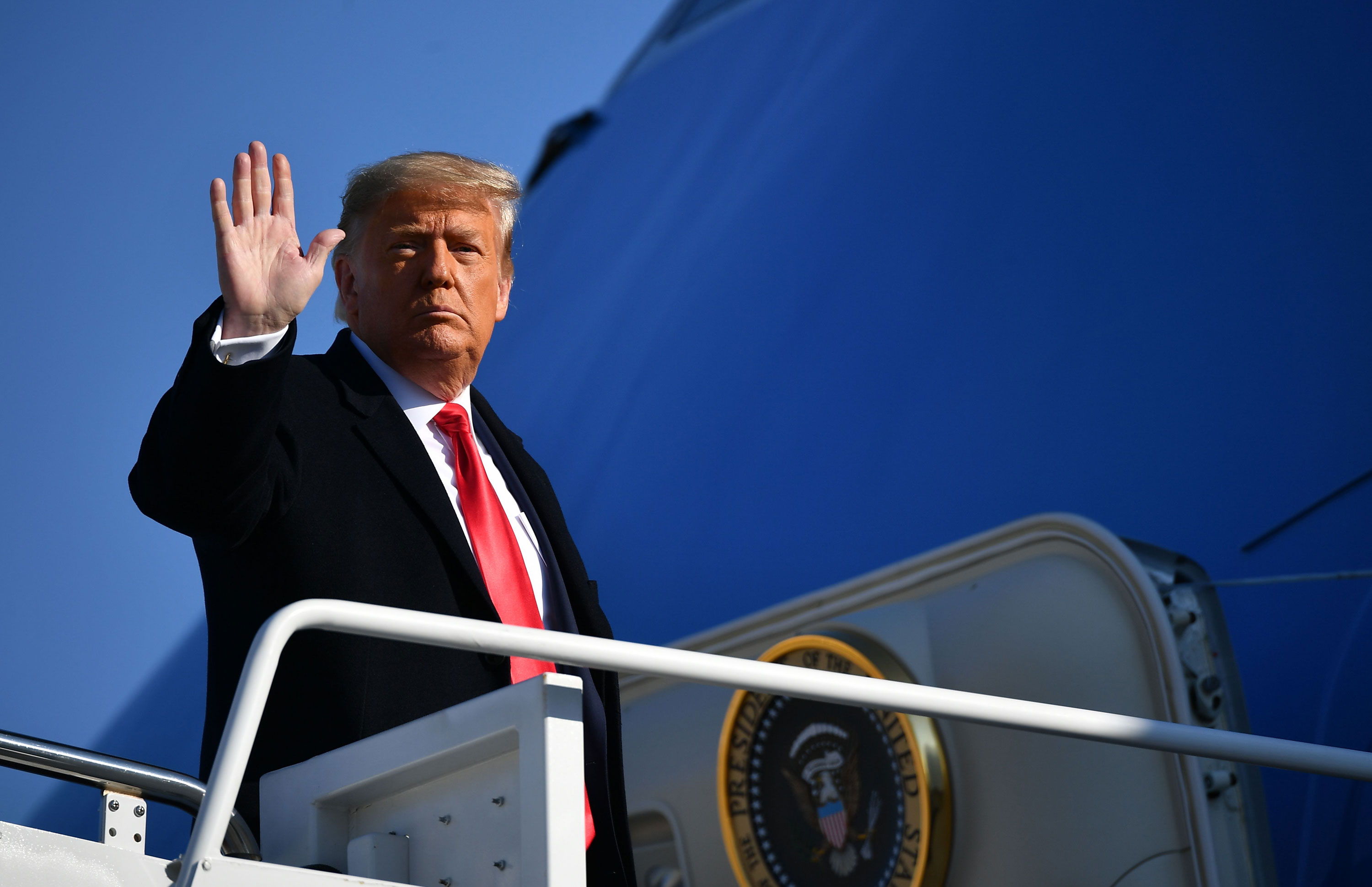 Trump moves to lift some Covid-19-related travel restrictions, but Biden plans to block the order