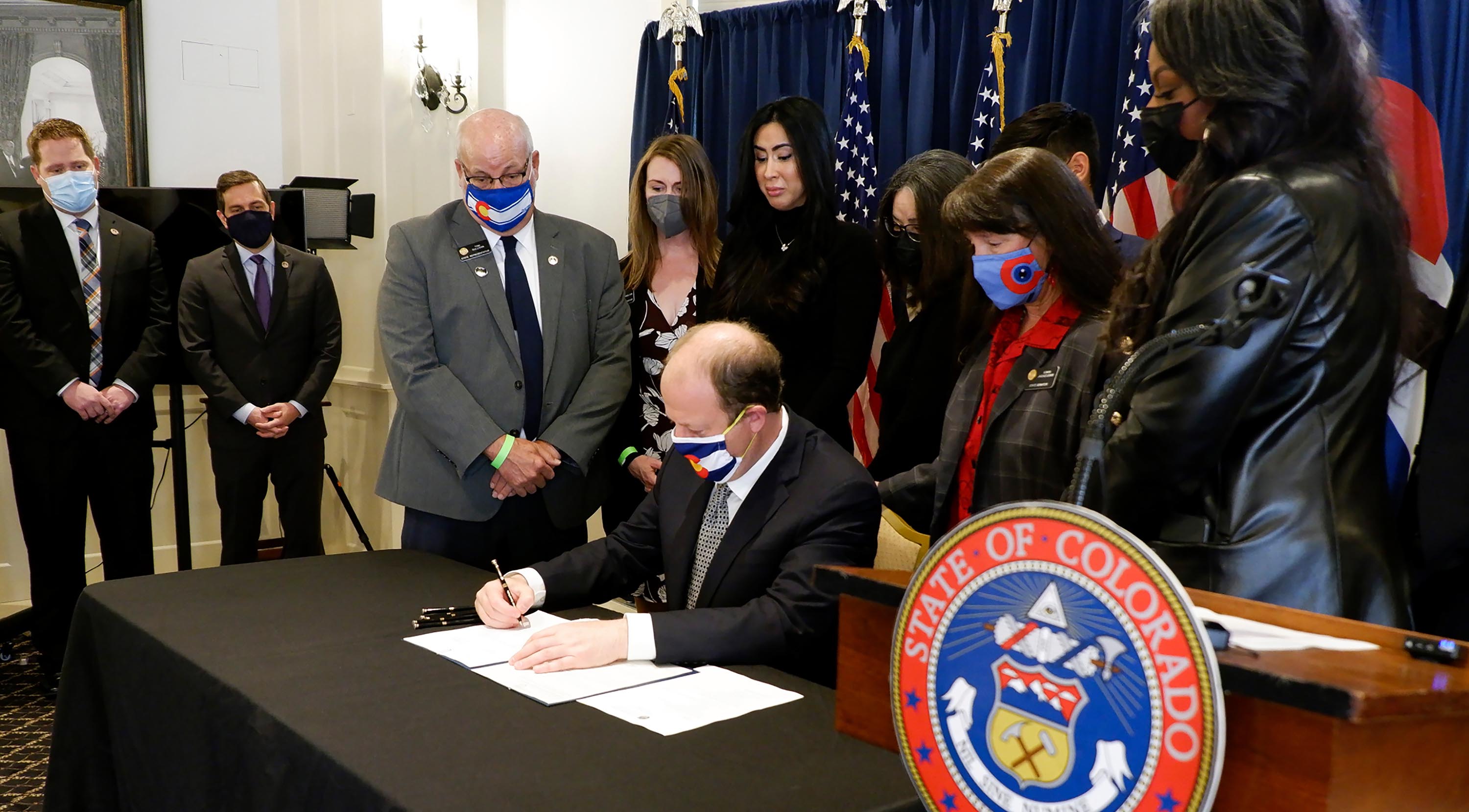 Colorado governor signs two gun measures into law nearly a month after Boulder shooting