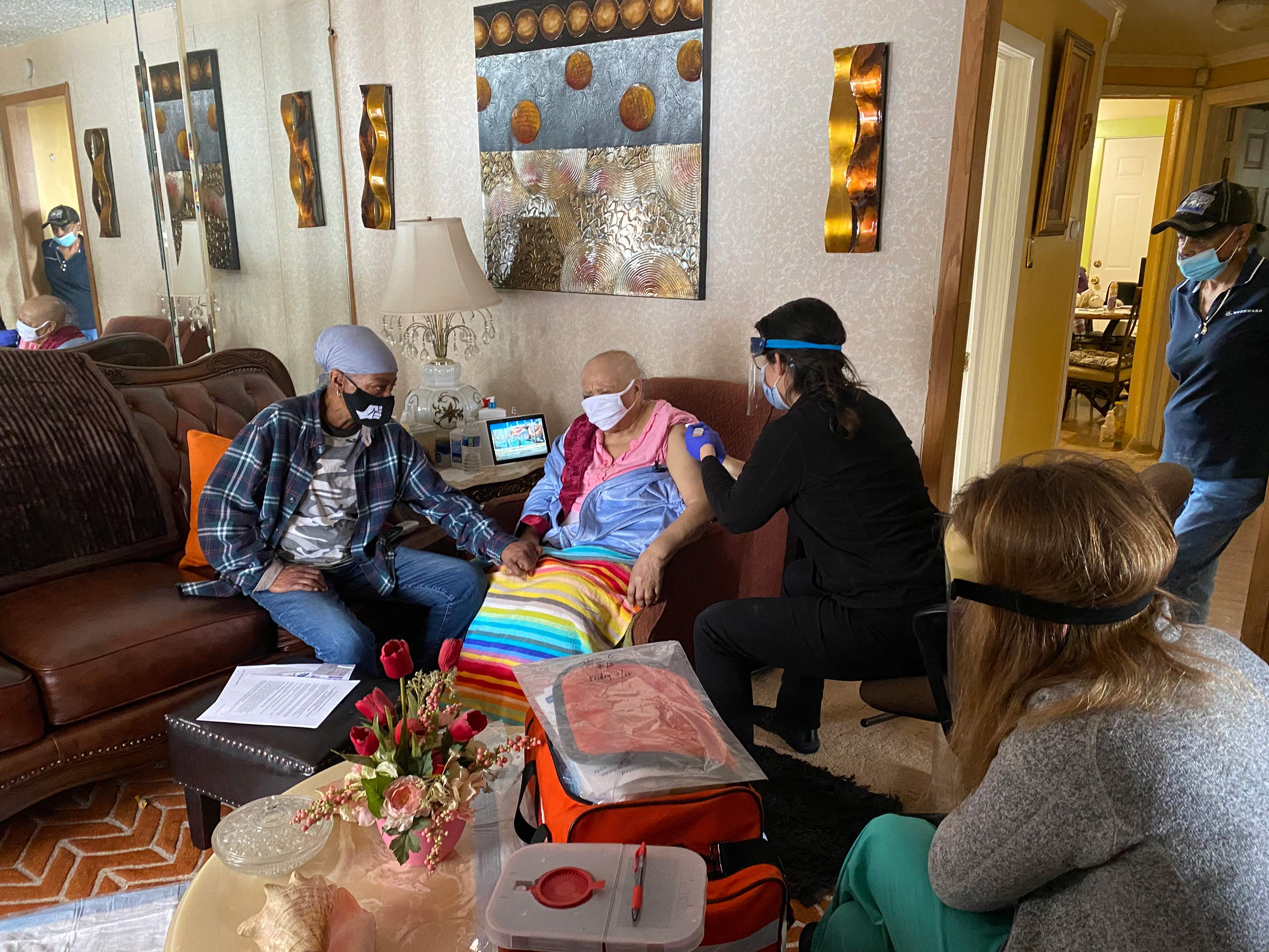 Doctors in Chicago are making house calls to give vulnerable patients the Covid-19 vaccine