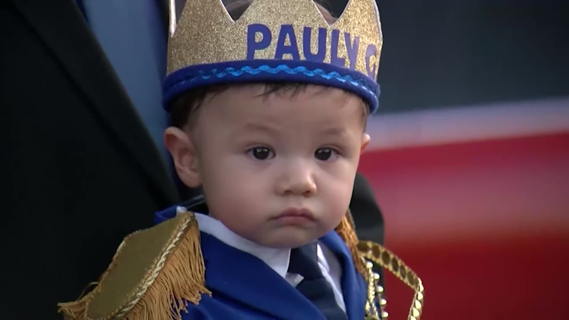 Hundreds took part in a parade celebrating the first birthday of a boy who lost both his parents in the El Paso shooting