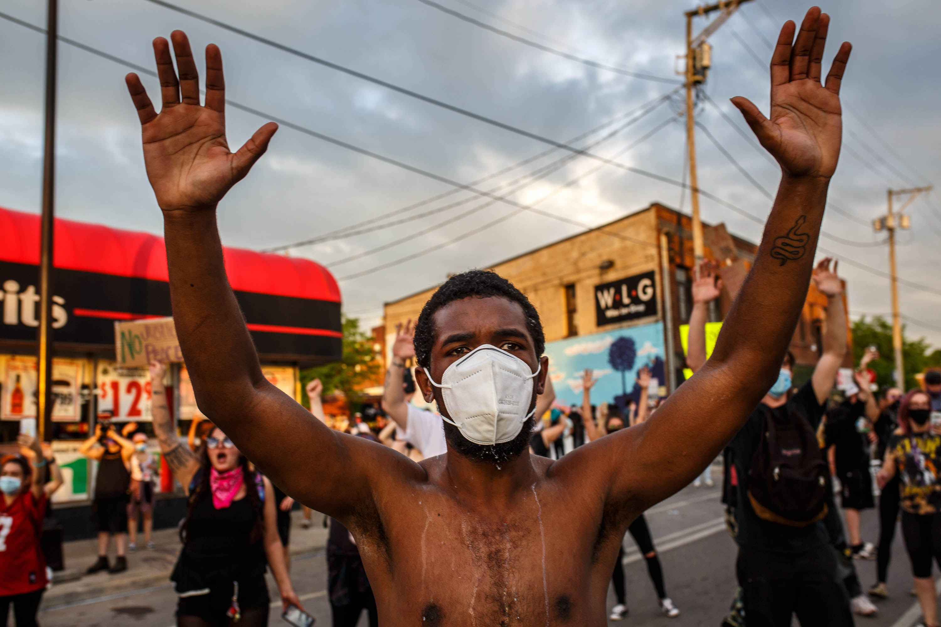 As a pandemic and protests over George Floyd’s death collide, officials stress: Wear a mask