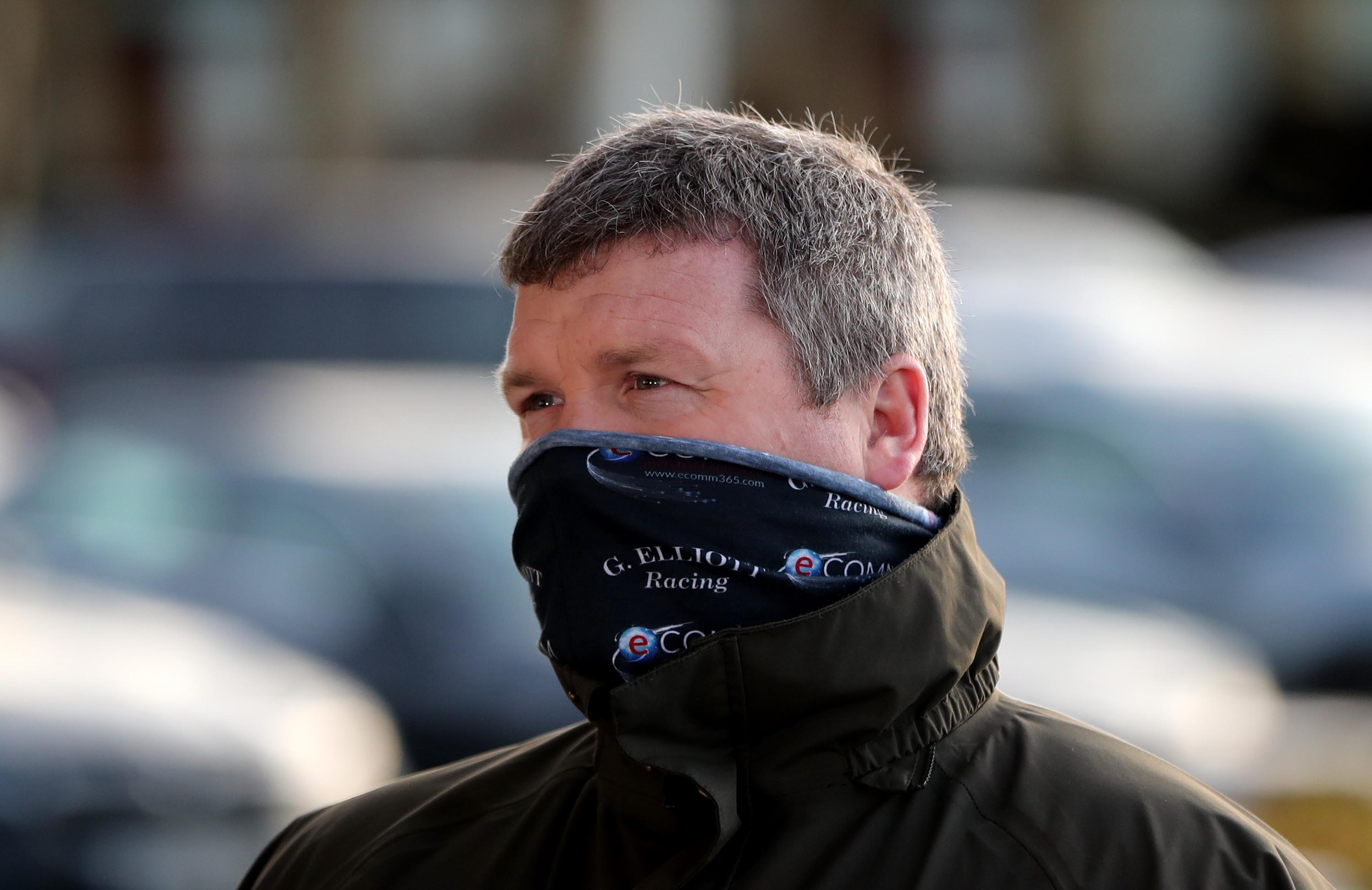 Top racing trainer Gordon Elliott apologizes over photo of himself sitting on a dead horse