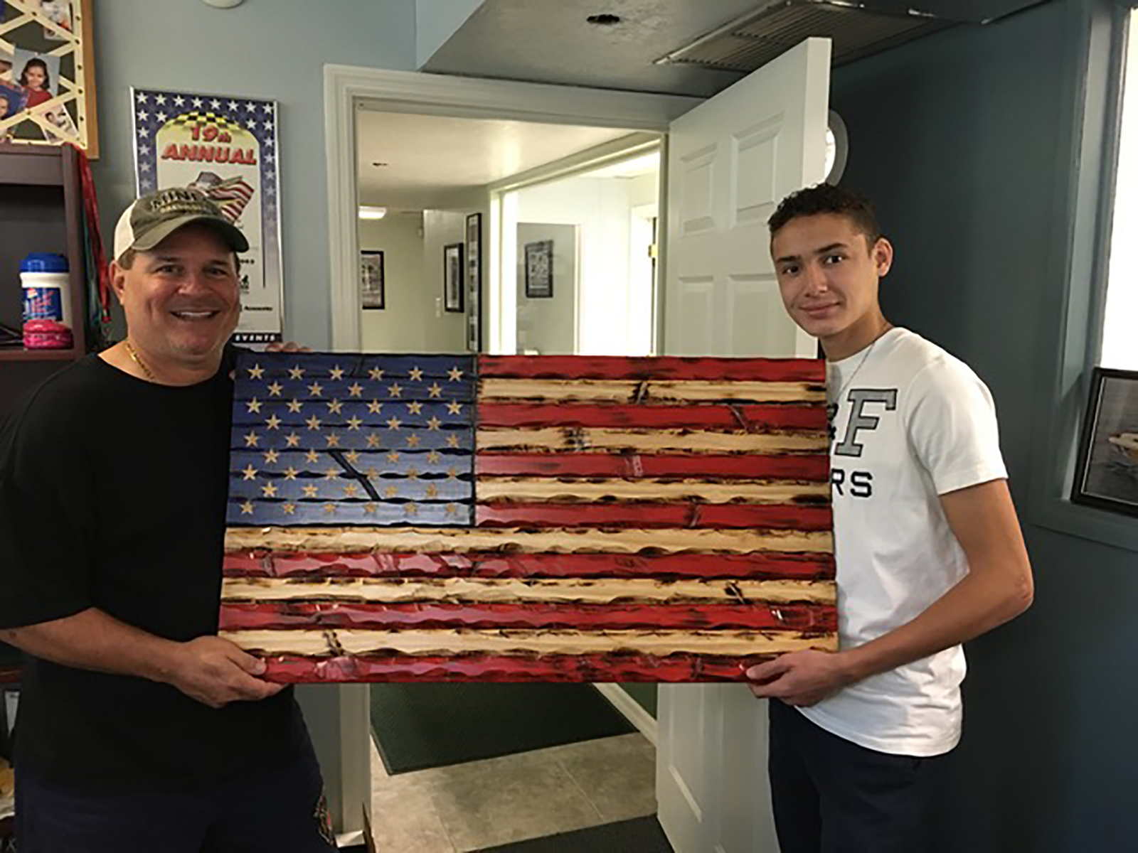 15-year-old boy is carving wooden flags to support ‘forgotten heroes,’ like veterans and first responders, during the pandemic