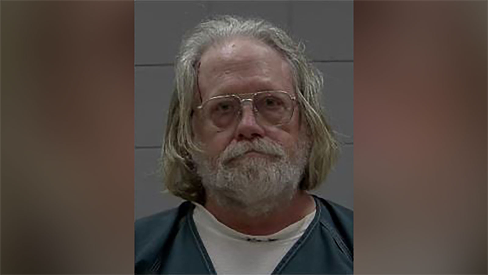 Man is arrested after trapping a police officer's arm in his truck window and speeding off, police say