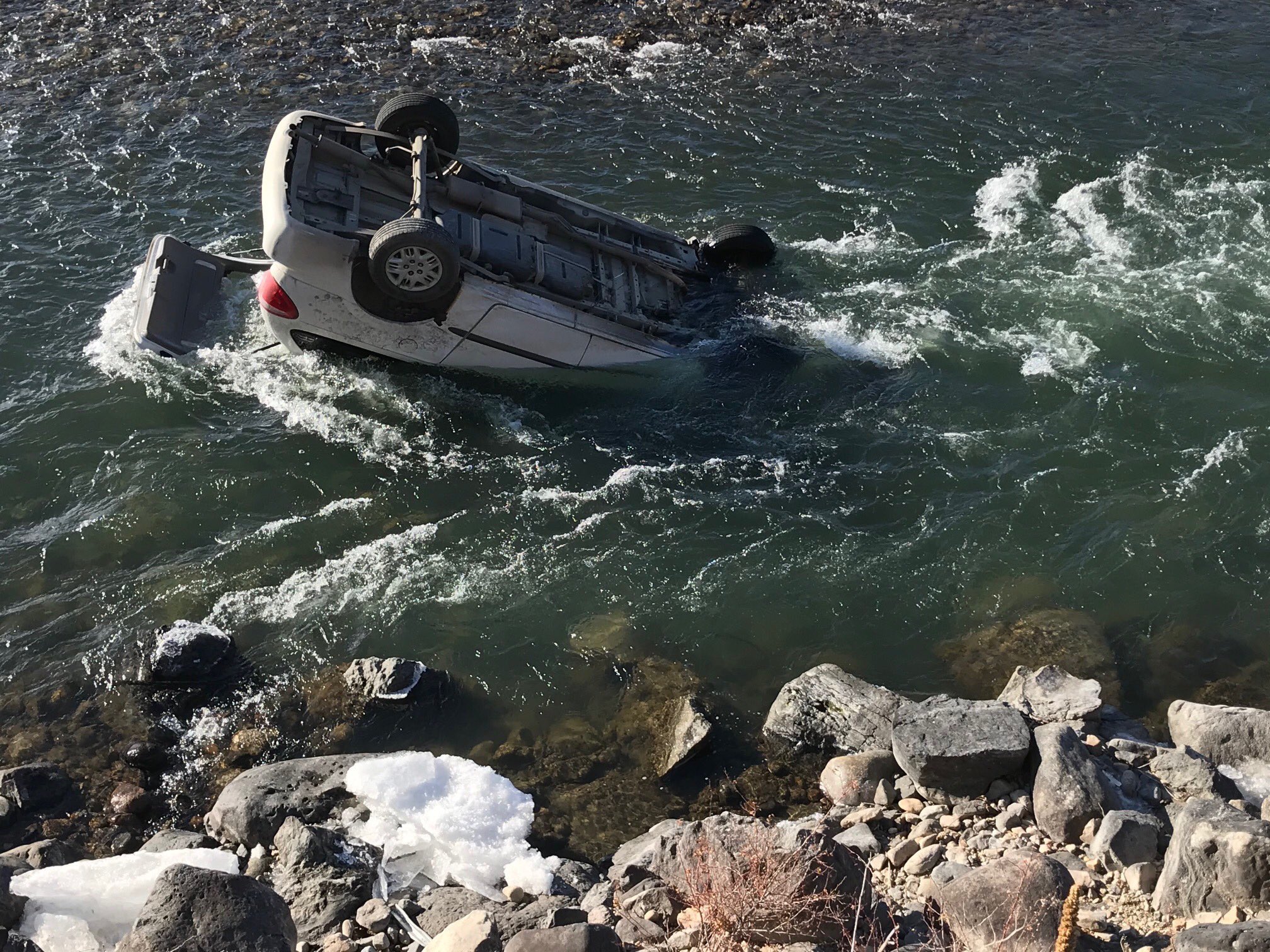 Montana trooper rescues driver from car submerged in icy river