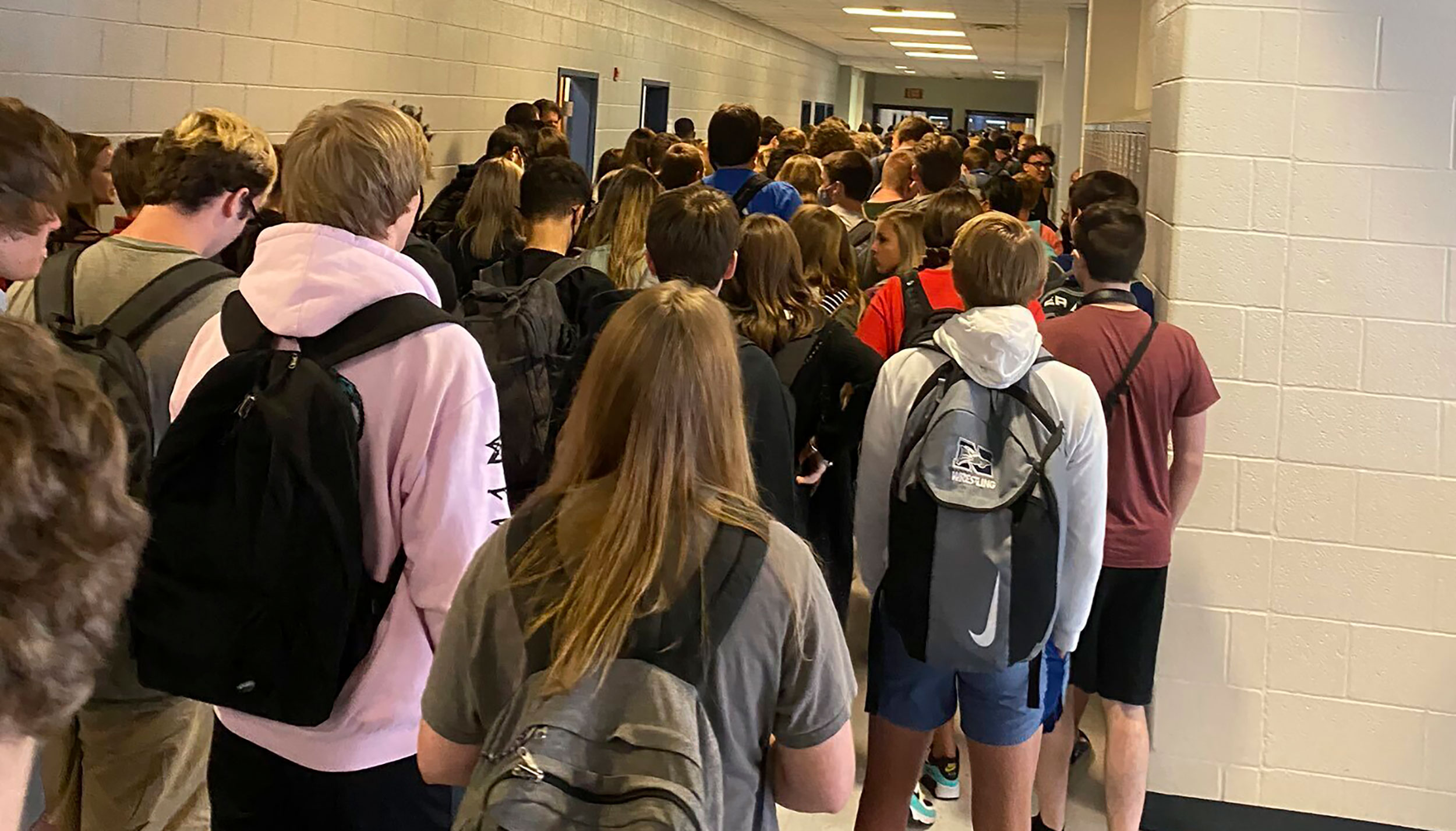 A school nurse in the district with the crowded hallway photo quit over a scarcity of Covid-19 precautions. Rising cases are 'not the validation' she wanted