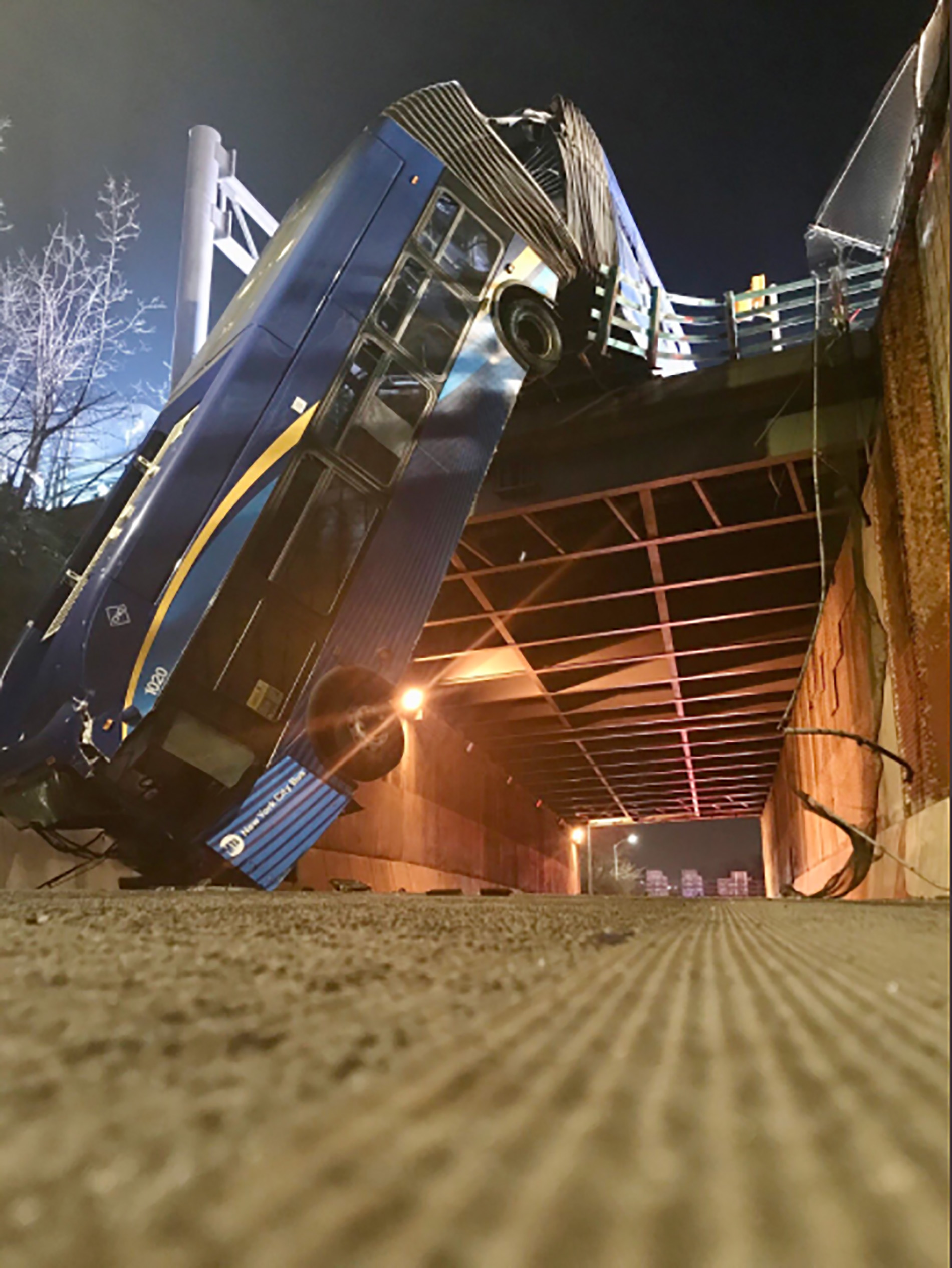 Bus is dangling from New York overpass after accident that left at least seven people injured