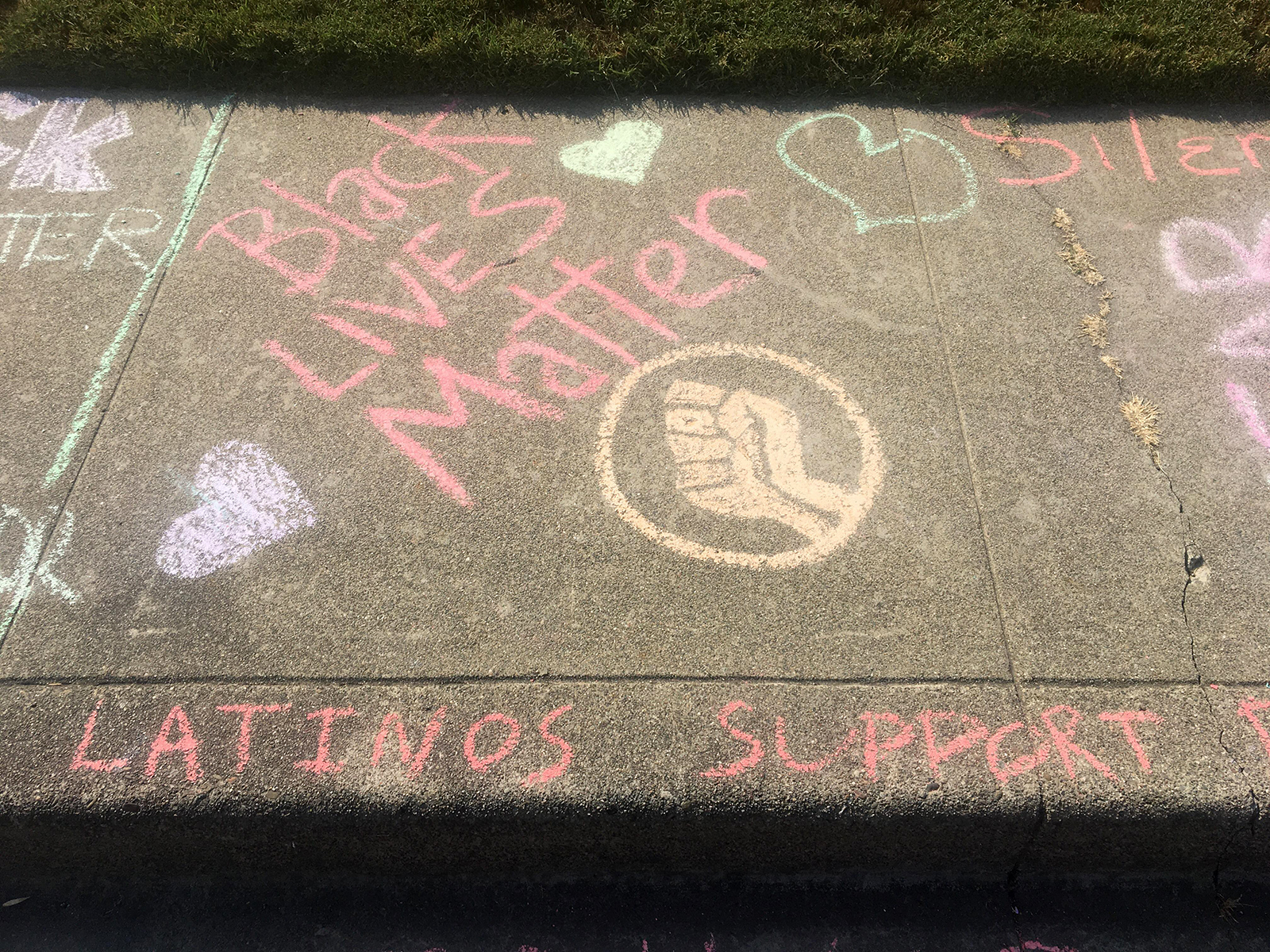 After a White man repeatedly erased girl's 'Black Lives Matter' chalk drawing in front of her home, neighbors stepped in to show support