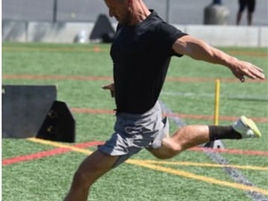 Adam W. action photo