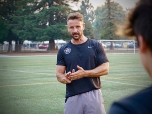 Adam W. action photo