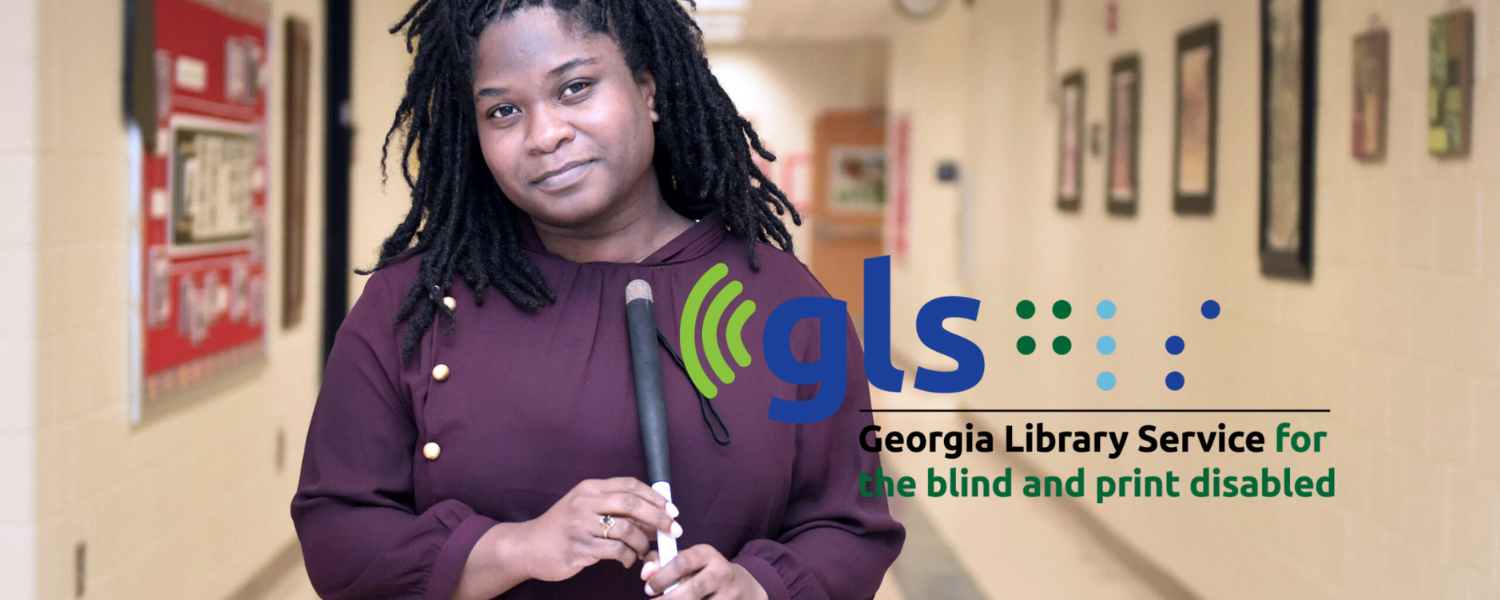 a Black woman holding a white cane stands in a hallway; the GLS logo sits on the photo slightly right of center