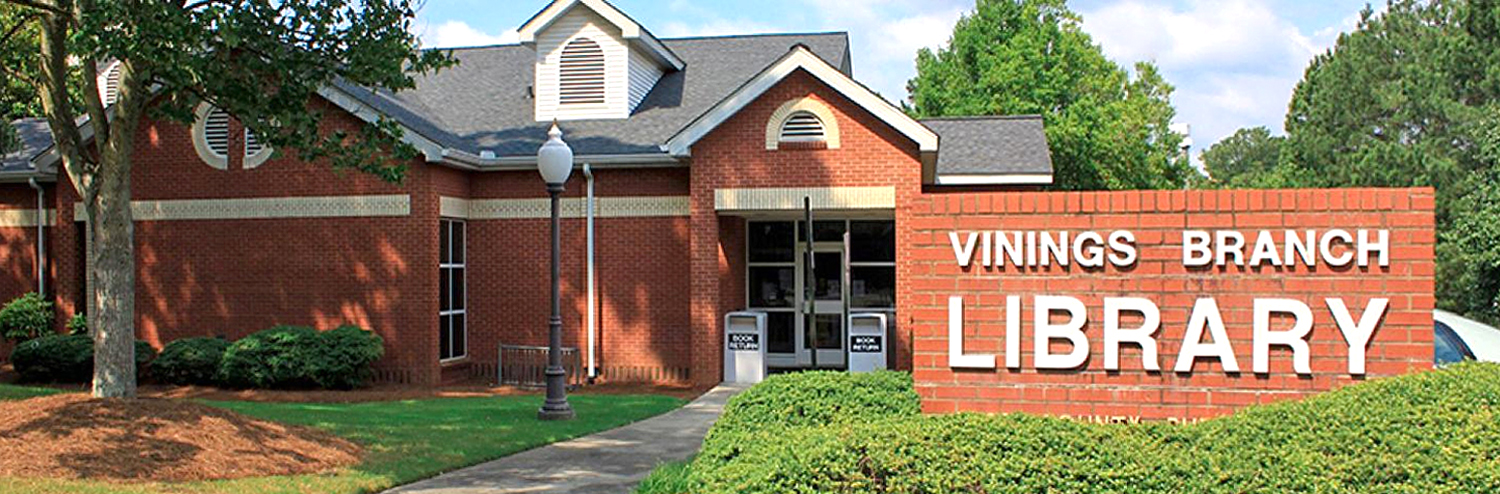 Vinings Library with brick sign to the right