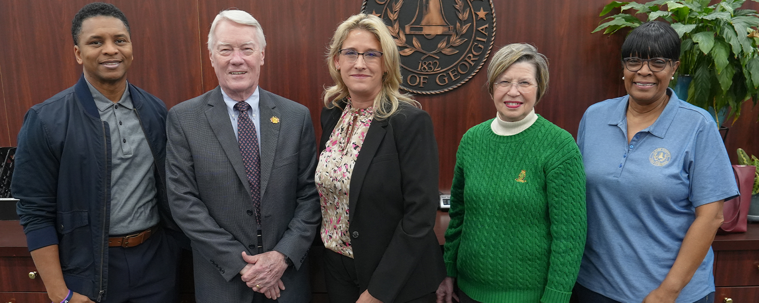 Stinchcomb posing with Board of Tax Assessors