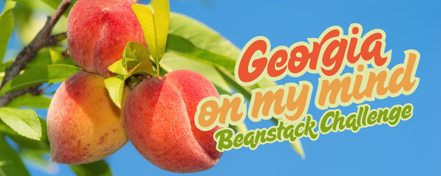 a bright blue sky with a close up photo of three ripe peaches on a branch of green leaves